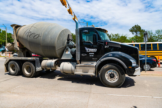 Dallas, USA - April 24, 2023: Tiseo Paving company Kenworth concrete mixer truck, side view