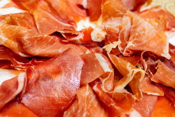 dish with plenty of thinly sliced serrano ham with a taste of Spain