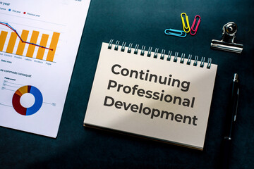 There is notebook with the word Continuing Professional Development. It is as an eye-catching image.