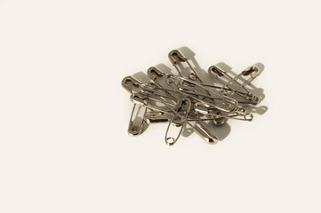 closed safety pins on a white background