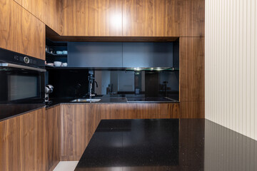 Black marble counter in modern kitchen interior