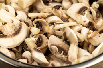 sliced white mushrooms mushrooms during cooking