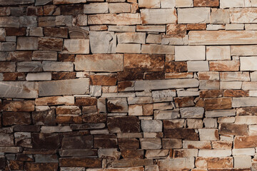 Texture stone brick background toned beige color
