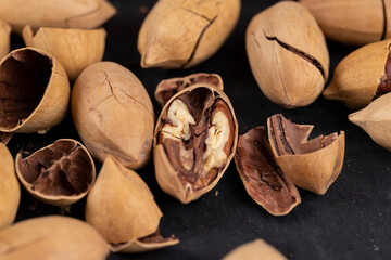 Unpeeled crunchy pecans close up