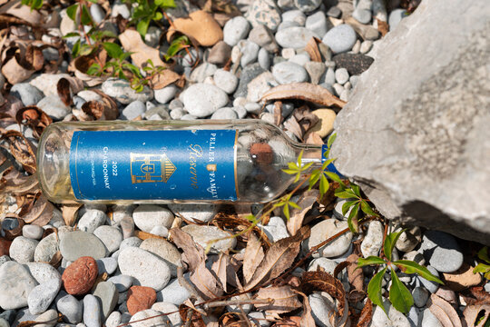 empty wine bottle on the beach (Peller Family Reserve Chardonnay 2022)
