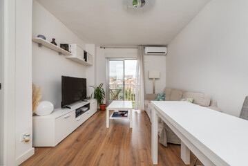 Fototapeta na wymiar Small living room furnished with white furniture