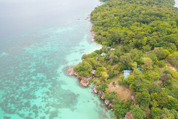 Aerial view of clear blue turquoise seawater, Andaman sea in Phuket island in summer season, Thailand. Water in ocean pattern texture wallpaper background.