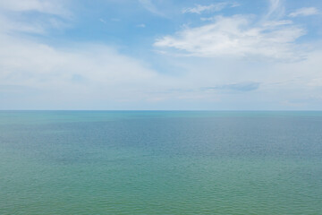 Aerial view of clear blue turquoise seawater, Andaman sea in Phuket island in summer season, Thailand. Water in ocean pattern texture wallpaper background.