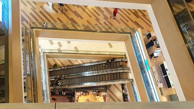 Pekanbaru, Indonesia - April 23, 2023: Top view of SKA shopping mall escalator between levels.