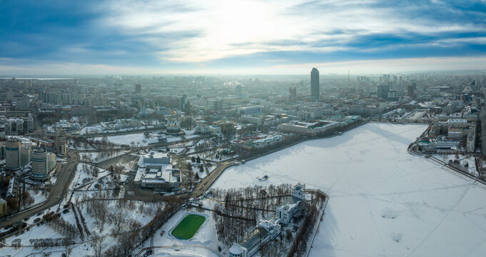 Embankment of the central pond and Plotinka in Yekaterinburg at winter sunset. The historic center of the city of Yekaterinburg, Russia, Aerial View