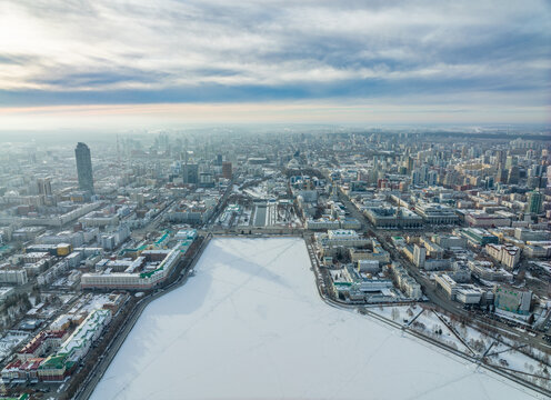 Embankment of the central pond and Plotinka in Yekaterinburg at winter sunset. The historic center of the city of Yekaterinburg, Russia, Aerial View