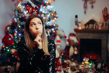 Woman Forgetting Something Important for Christmas Celebration. Lonely girl suffering from seasonal affective disorder 
