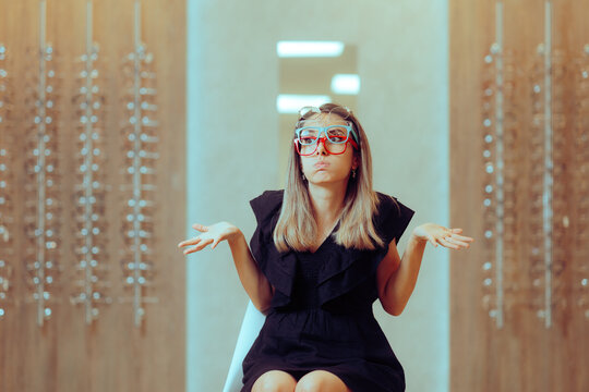 Funny Woman Having Many Options for New Glasses Frames. Stylish girl deciding which glasses suits her best 
