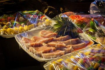 Decoration and raw foods that are wrapped with plastic wrap prepared for the wedding dinner party.