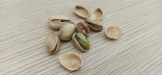 Pistachios on a wood texture background. Isolate.