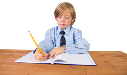 Digital png photo of smiling caucasian schoolboy writing on transparent background