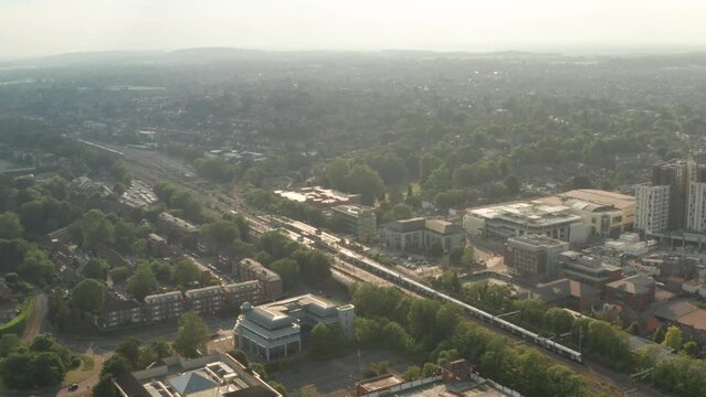 Aerial slider shot of Elizabeth line train leaving Maidenhead train station