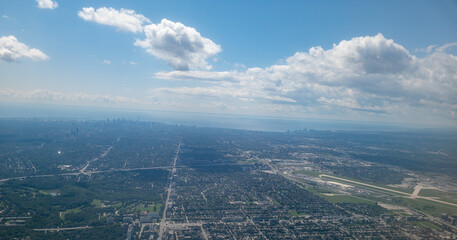 View of Toronto, Ontario from an airplane on a partly cloudy day