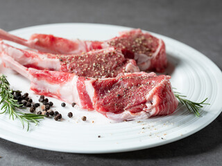 Raw lamb ribs seasoned with various spices