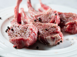 Raw lamb ribs seasoned with various spices