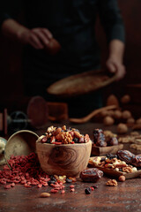 Various dried fruits and nuts on a kitchen table.