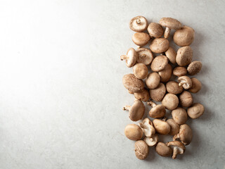 Fresh shiitake mushrooms on marble background