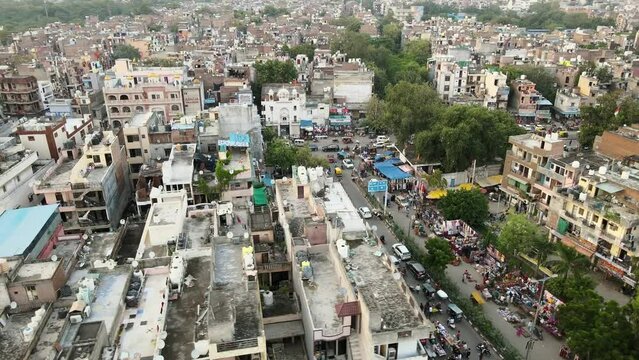 4K Aerial Shots of Local market in New Delhi Residential Suburbs on a beautiful day gliding over Rooftops, streets, parks and markets in India