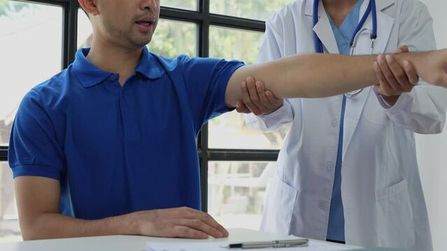 The doctor counsels the patient about pain in the muscles of the arms and elbows. office syndrome problem physical therapy diagnostic concept