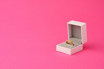 Small jewelry box on pink studio background