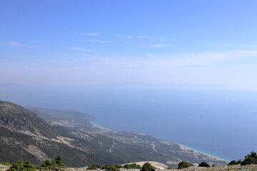 View on Dhermi from the famous SH8 road at the Llogara Pass in Albania - a high mountain pass within the Ceraunian Mountains along the Albanian Riviera. Tourist attraction. 