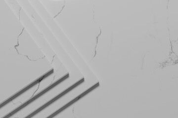 Simple black and white marble background with light streaming in.