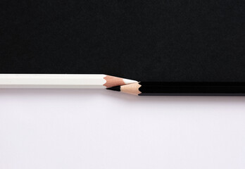 Harmony of opposites. Contrasts and opposition. Confrontation. Black and white equality.