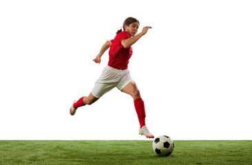 Fototapeta premium Dynamic image of young girl, football, soccer player in motion, dribbling ball isolated over white background