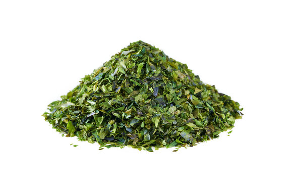 green nori seaweed kelp alga powder flake isolated on white background. heap of green nori seaweed kelp alga powder flake isolated. pile of green nori seaweed kelp alga powder flake isolated