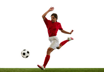 Dynamic image of young woman, football player in motion, kicking ball in jump isolated over white...