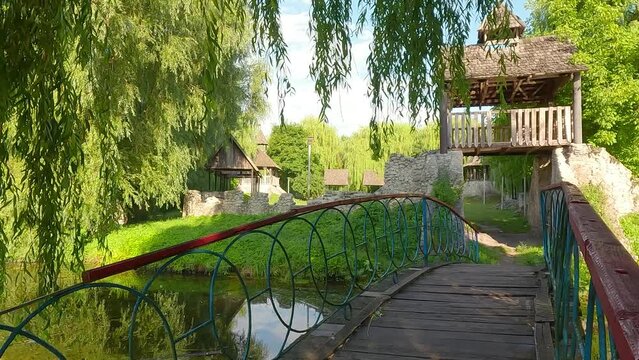 Calm morning scene of Topilche Park in Ternopil city with wooden tower, Ukraine, Europe. Fresh green view of Seret river. Beauty of nature concept background. 4K video (Ultra High Definition).