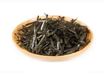 crispy dry slice seaweed nori kelp alga in wood plate isolated white background. pile of crispy dry slice seaweed nori kelp alga in wood plate isolated. heap of crispy dry slice seaweed nori kelp alga © boommaval