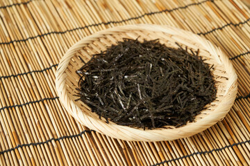 crispy dry slice seaweed nori kelp alga in wood plate on table background. close up crispy dry slice seaweed nori kelp alga on table background. crispy dry slice seaweed nori kelp food background