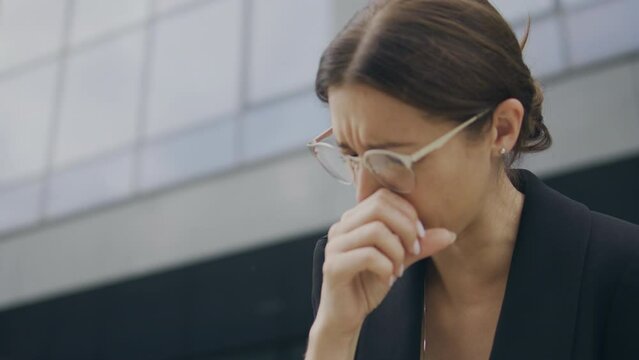 Business woman coughing, has chocked or suffering bronchial asthma, close-up