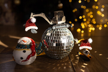 Christmas holidays, festive atmosphere. toy excavator models, mirror disco ball, snowman, bokeh,...