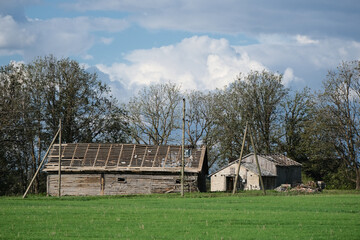 Obraz premium house in countryside with damaged naked roof.
