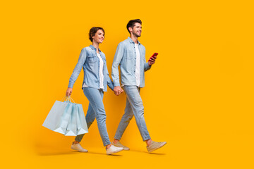 Photo of two people dating in shopping center browsing smart device isolated bright color background