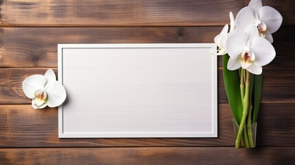 White orchid and photo frame on background