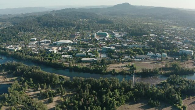 An establishing shot of the Willamette River and the University of Oregon campus.