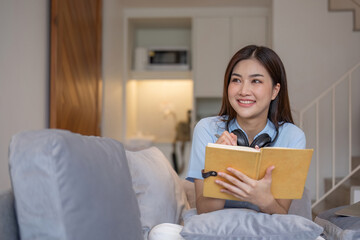Naklejka premium Asian girl student online learning class study online video call zoom teacher, Happy asian girl learn english language online with computer laptop...