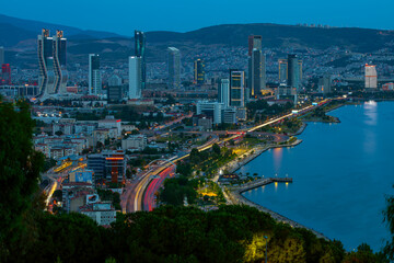 Fototapeta premium View of Izmir Bay in the evening from the high hill of Bayrakli. Long exposure, low light.