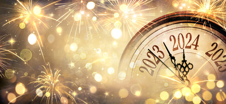 2024 New Year - Clock And Golden Fireworks - Countdown To Midnight  - Abstract Defocused Background