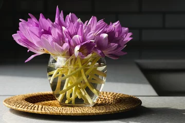 Foto op Canvas Bunch of crocus flowers in a glass vase in the kitchen. © puhimec