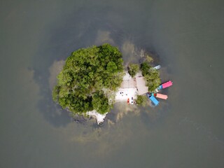 small island in the water in veracruz mexico aerial with boats in the coast