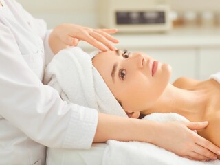 Obraz na płótnie Canvas massage, woman, spa, beauty, care, treatment, face, wellness, relaxation, body, skin, facial, health, therapy, head, people, relax, lifestyle, lying, salon, healthcare, hand, towel, relaxing, healthy